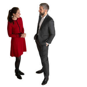 man and woman talking at a formal event