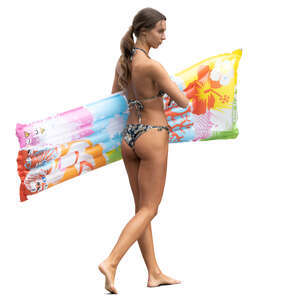woman with a swim mattress walking