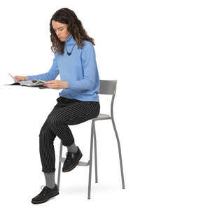 woman sitting at a counter and reading