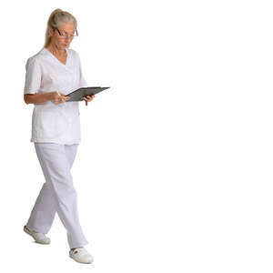 older nurse with some papers walking