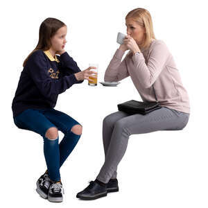 mother and daughter sitting in a cafe and talking