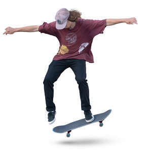 teenage boy doing a stunt on a skateboard