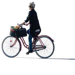 sidelit woman riding a bike