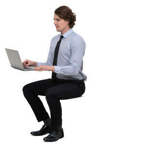 businessman sitting at a desk and working with computer