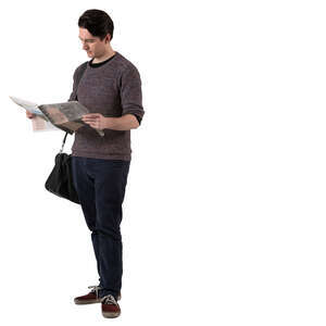 man standing and reading a newspaper