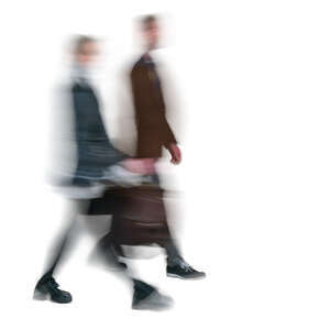 two motion blurred people walking