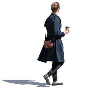 woman in a blue overcoat drinking coffee on the go