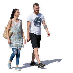 smiling man and woman walking on a sunny day