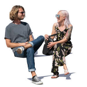 man and woman sitting and talking