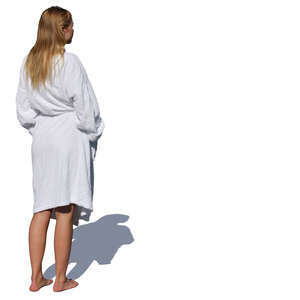 woman in a white bathrobe standing