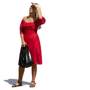 woman in a red dress standing and looking up