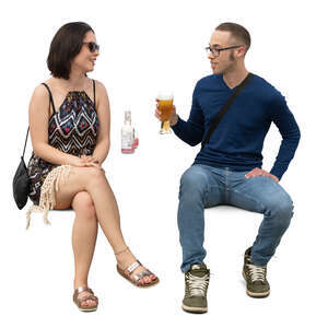 man and woman sitting in a street cafe