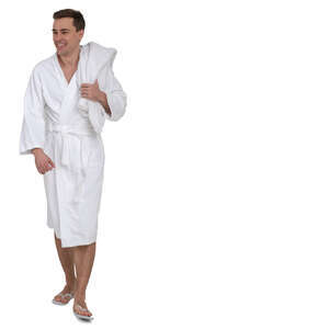 man in a white bathrobe walking