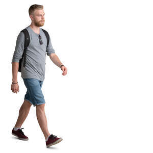 young man with a beard walking