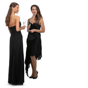 two women in black evening dresses at a formal event standing and talking