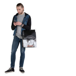 man with many shopping bags standing and checking his phone