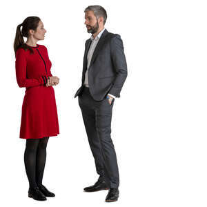 man and woman standing and talking on a formal occasion
