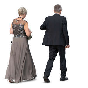 older couple in formal clothes walking