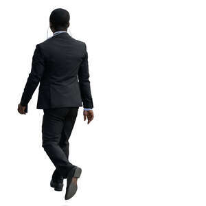 black businessman with earphones walking
