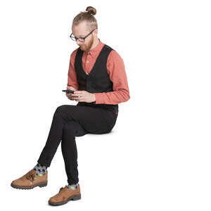 trendy young man sitting and looking at his phone