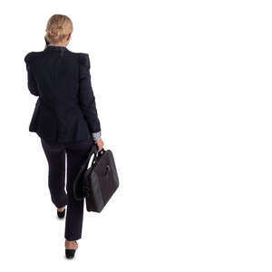 businesswoman walking and talking on a phone seen from above