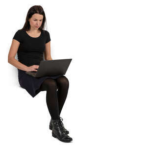 woman sitting with a laptop on her knees
