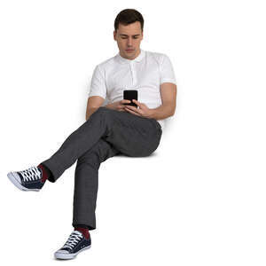 man sitting casually and checking his phone