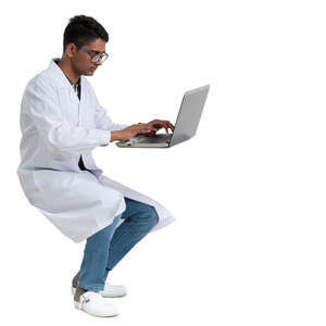 young scientist working at a table with a laptop