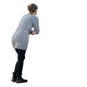 woman standing and leaning on a railing