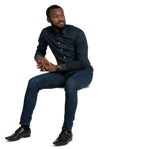 man sitting casually and leaning on a table