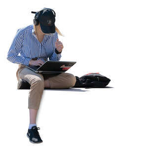 woman with laptop and headphones sitting