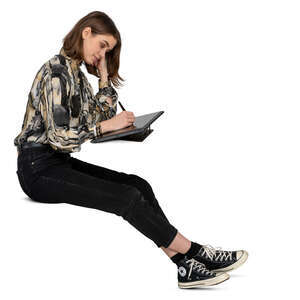 woman sitting and drawing on a graphics tablet