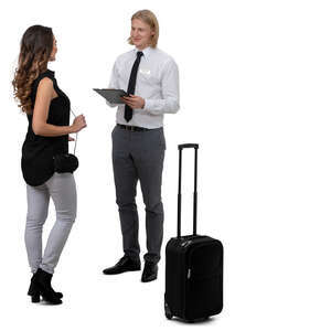 woman standing and talking to a hotel receptionist