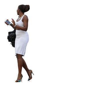 black woman in a white summer dress walking