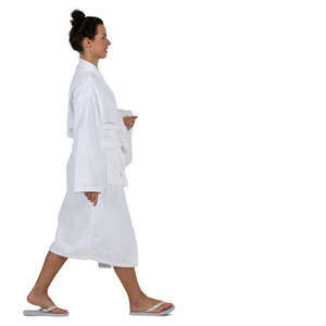 woman in a white bathrobe walking