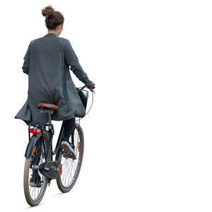 woman in a grey jacket riding a bike