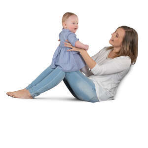 woman sitting on a sofa and playing with her baby girl