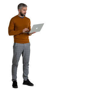 man standing and holding a laptop 