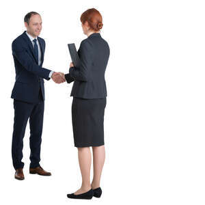 man and woman shaking hands at a business meeting
