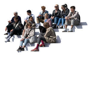 group of young people sitting on the stairs and talking