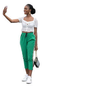 young black woman standing and taking a selfie