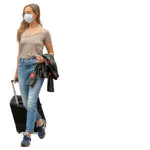 cut out young woman with a protective face mask walking at the airport