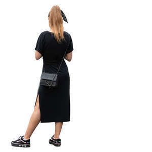 cut out woman in a black dress standing casually