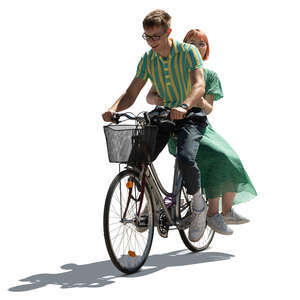 cut out young backlit couple riding a bicycle