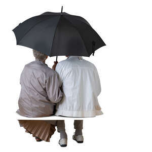 cut out elderly couple sitting under an umbrella