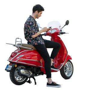 cut out man sitting on a red vespa scooter