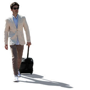 cut out backlit young man with a suitcase walking