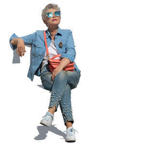 cut out trendy elderly woman sitting on a chair and relaxing