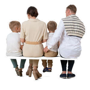 cut out family with two kids sitting seen from behind