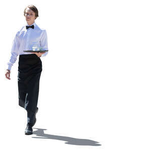 cut out backlit young male waiter carrying a tray walking